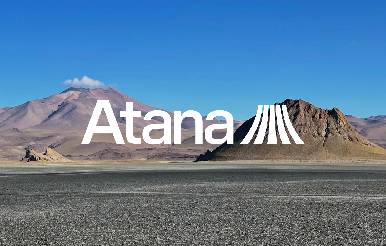 Atana Elements logo over a salt flat with a volcanic peak in the distance